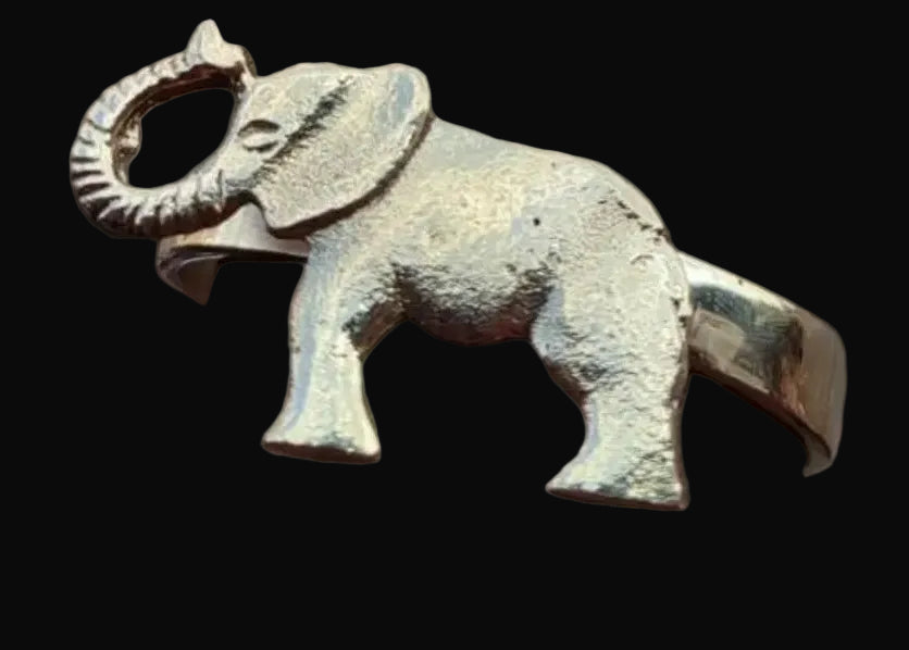 Brass Elephant cuff on a black background