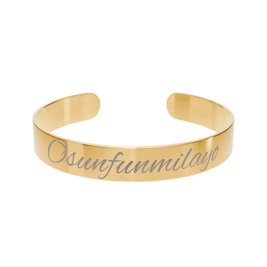 Gold bracelet with engraved name 
Ayo Adornments